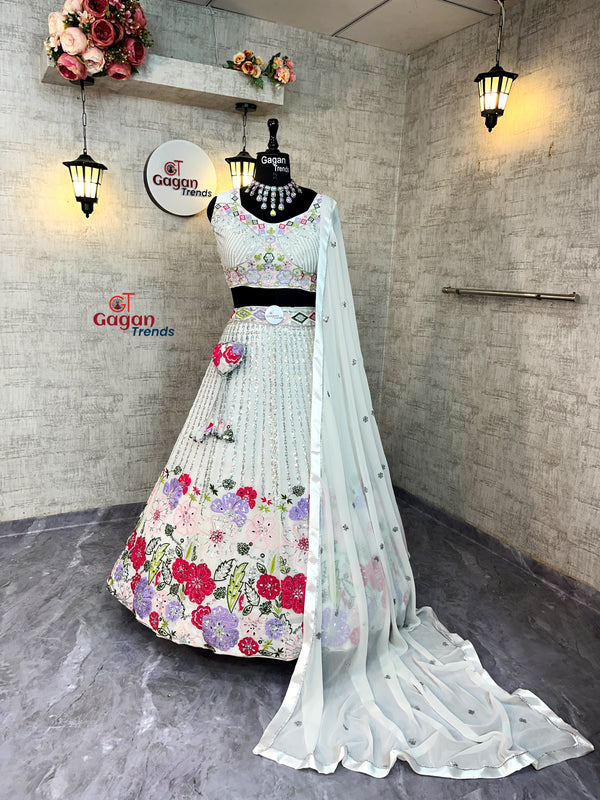 Floral dress with a sheer dupatta on a mannequin against a gray wall.