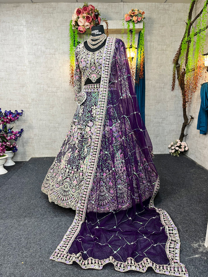 A mannequin displaying a purple color lehenga with coding sequins work and a designer blouse, along with a dupatta.