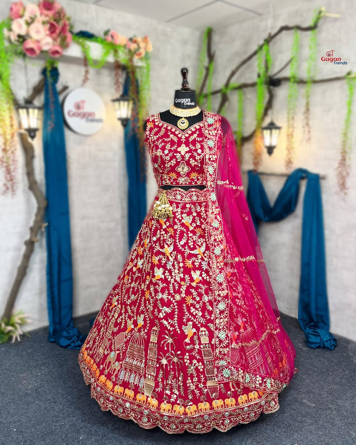 A mannequin displaying a red and pink lehenga with embroidery and sequins work, along with a butterfly net dupatta.